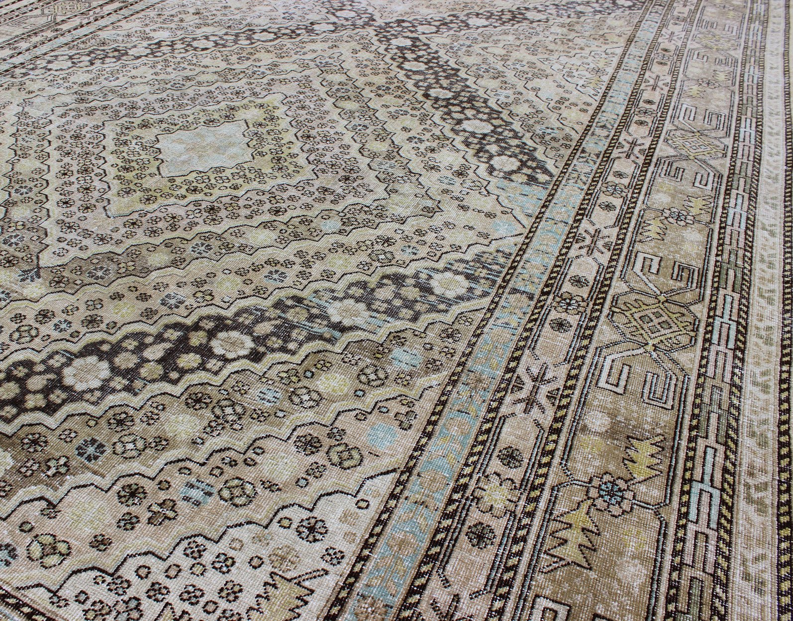 Antique Turkestanian Khotan rug with paired diamond geometric medallions, rug gld - 8495, country of origin / type: East Turkestan / Khotan, circa 1910. This delicately rendered antique Khotan rug was handcrafted in Turkestan during the early part... - Keivan Woven ArtsGLD - 8495 - 9098Rug