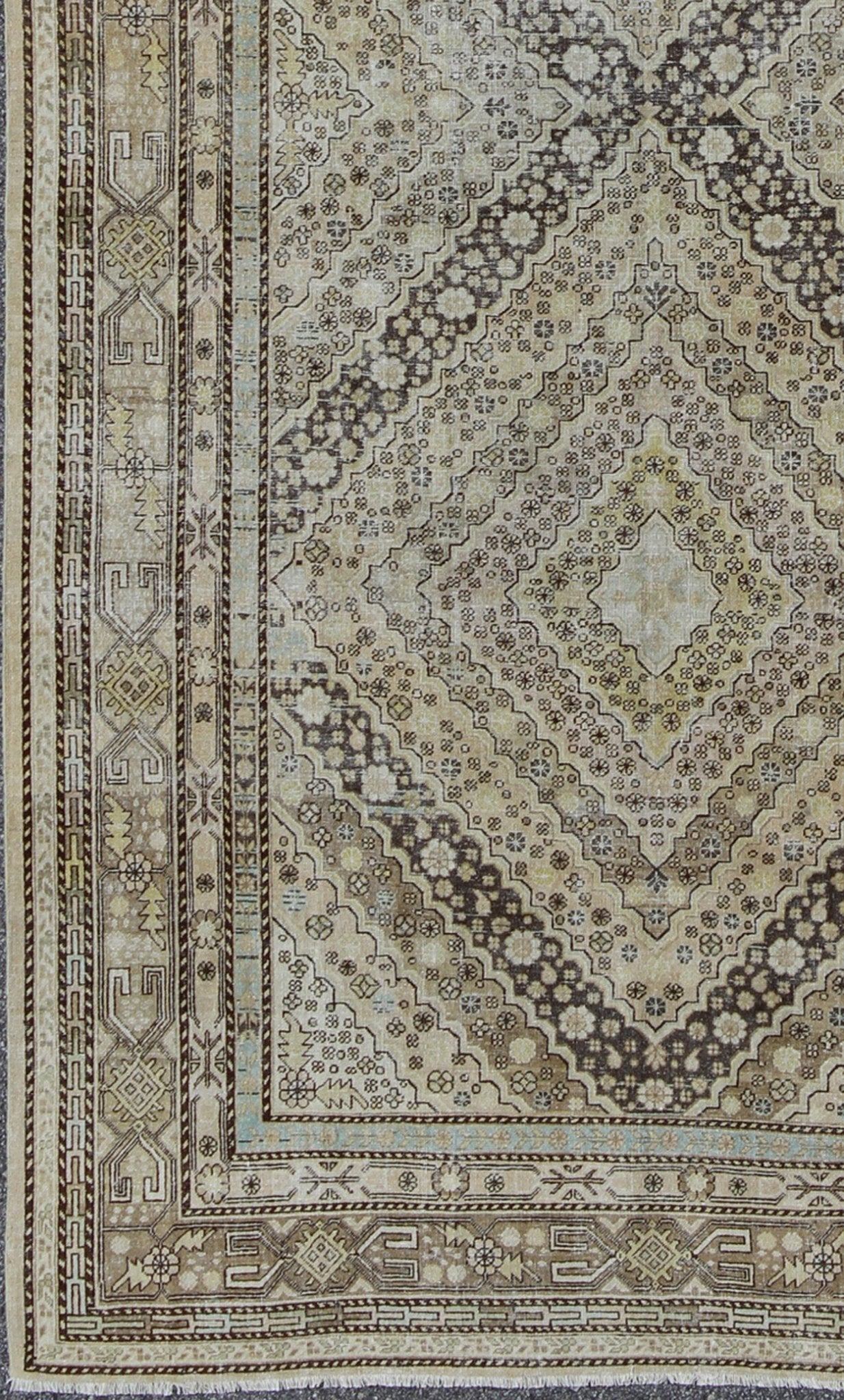 Antique Turkestanian Khotan rug with paired diamond geometric medallions, rug gld - 8495, country of origin / type: East Turkestan / Khotan, circa 1910. This delicately rendered antique Khotan rug was handcrafted in Turkestan during the early part... - Keivan Woven ArtsGLD - 8495 - 9098Rug