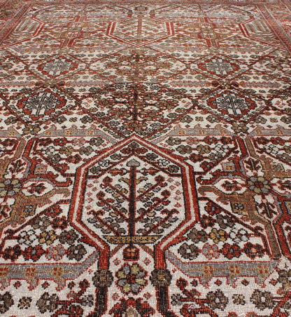 Antique Persian Joshegan Rug in Ivory Background with Red, Green and Blue This antique Joshegan rug from 1920s Iran was handwoven and bears a remarkably unique all - over interconnected Sub - geometric design, consisting mostly of diamond shapes and re... - Keivan Woven ArtsGNG - 4741 - 9898Rug