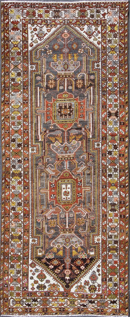 Geometric Medallion Design Vintage Persian Bakhtiari Runner in Orange, Olive, Brown, Ivory, and Gray, rug gng - 4753, country of origin / type: Iran / Bakhtiari, circa 1930 Persian Bakhtiari rugs are in fact tribal pieces that rely upon a repertoi... - Keivan Woven ArtsGNG - 4753 - 9926Rug
