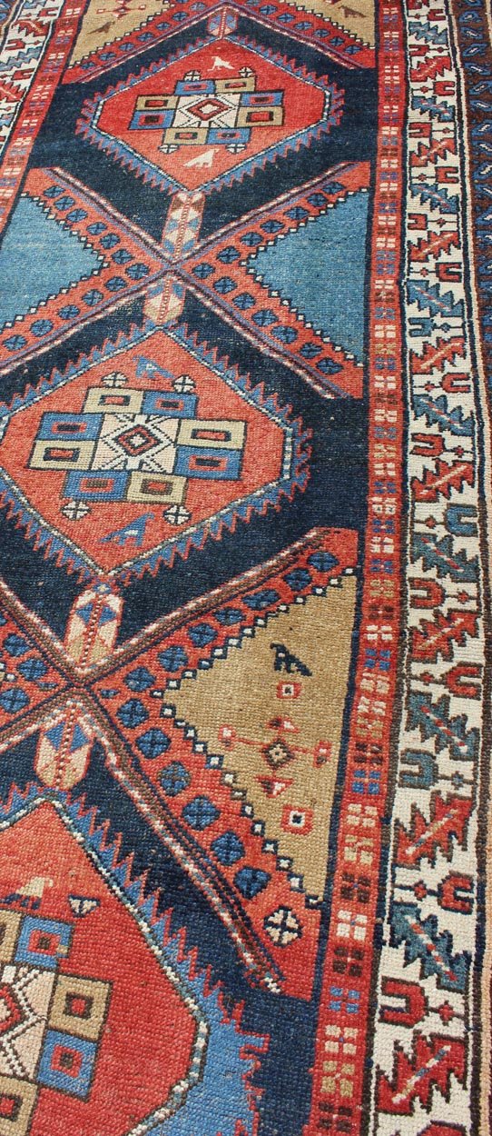 Bold Medallion Design Antique Hand Knotted Persian Heriz Runner in Red and Blue Tones Persian Heriz antique gallery rug with Sub - geometric medallion design in colorful tones, Keivan Woven Arts / rug gng - 4774, country of origin / type: Iran / Her... - Keivan Woven ArtsGNG - 4774 - 9972Rug