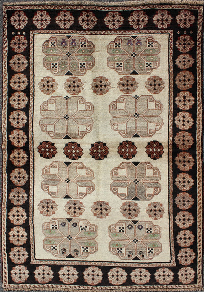 Persian Gabbeh Vintage Rug With Blossom Medallions in Brown, Ivory, Taupe, Green and Black 1950s Persian Gabbeh vintage kwarugs h - 1205 - 04, country of origin / type: Iran / Gabbeh, circa 1950 This high - pile mid - 20th century vintage Persian Gabbeh... - Keivan Woven ArtsH - 1205 - 04 - 4138Rug