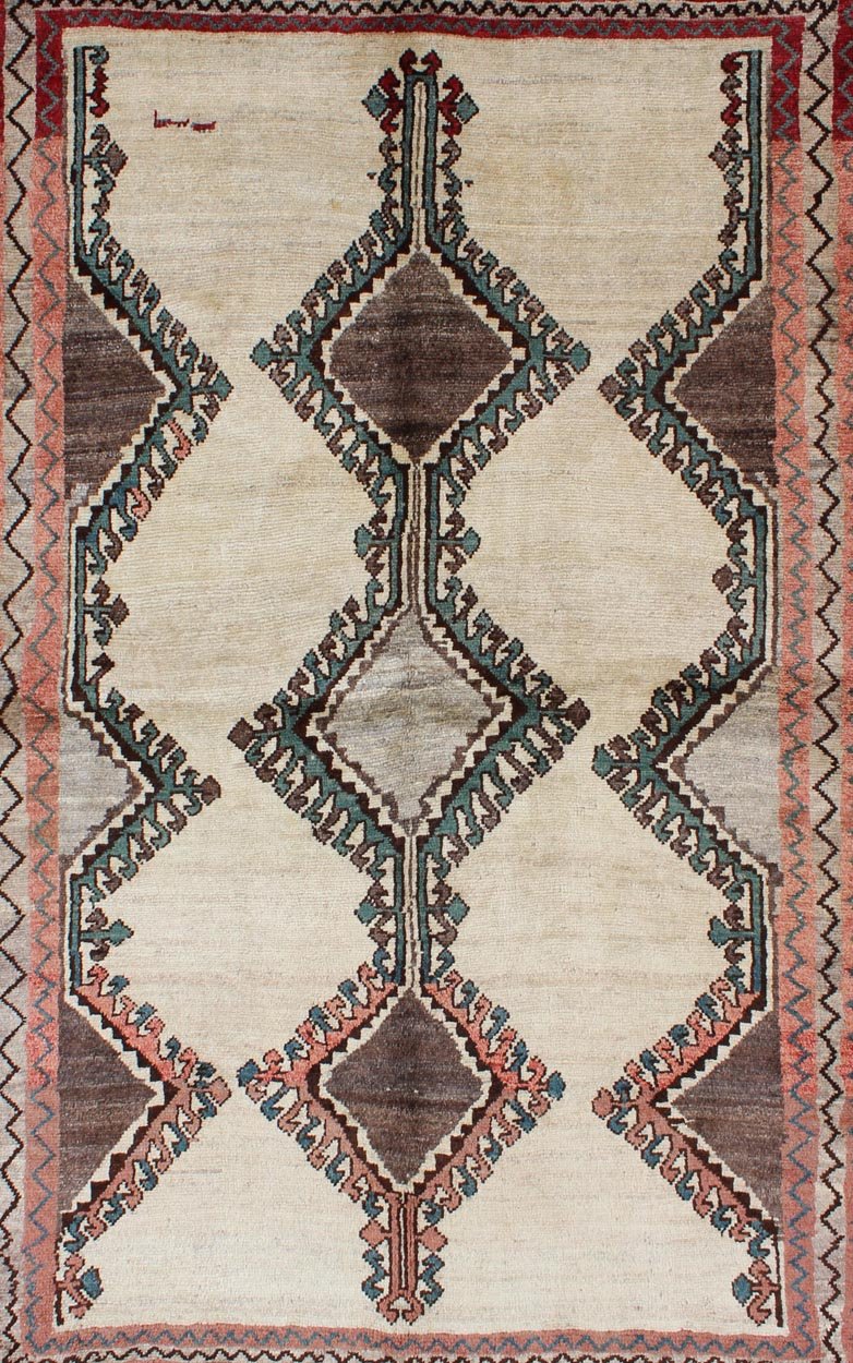 Keivan Woven Arts, H - 1205 - 06, 1950s Semi Antique Gabbeh Rug This Semi Antique Gabbeh carpet features a geometric design, including a repeating diamond design in its central field. Multiple tribal - patterned borders surround the field and frame entire... - Keivan Woven ArtsH - 1205 - 06 - 4148Rug