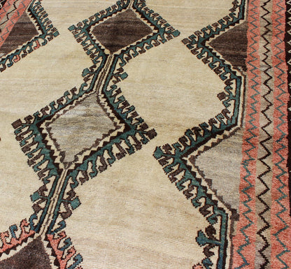 Keivan Woven Arts, H - 1205 - 06, 1950s Semi Antique Gabbeh Rug This Semi Antique Gabbeh carpet features a geometric design, including a repeating diamond design in its central field. Multiple tribal - patterned borders surround the field and frame entire... - Keivan Woven ArtsH - 1205 - 06 - 4148Rug