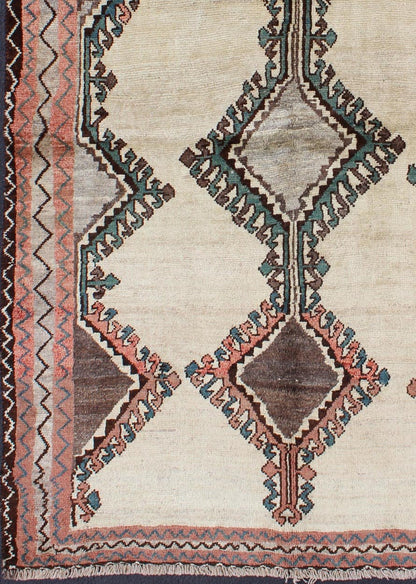 Keivan Woven Arts, H - 1205 - 06, 1950s Semi Antique Gabbeh Rug This Semi Antique Gabbeh carpet features a geometric design, including a repeating diamond design in its central field. Multiple tribal - patterned borders surround the field and frame entire... - Keivan Woven ArtsH - 1205 - 06 - 4148Rug
