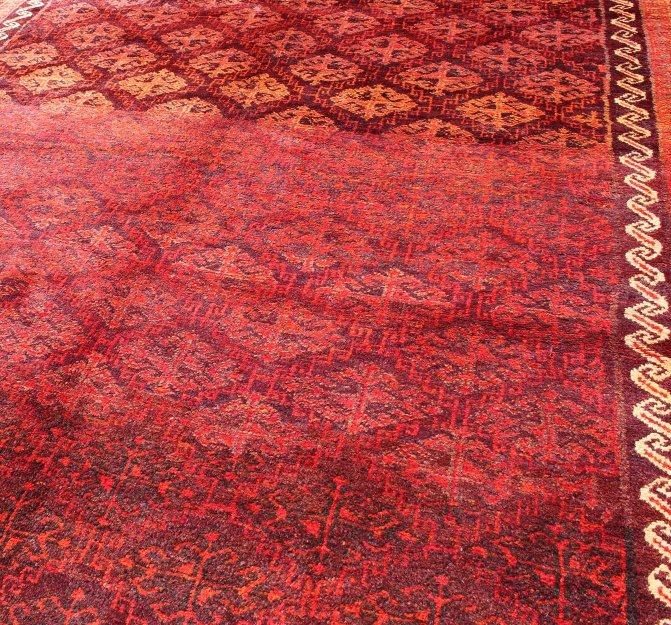 Keivan Woven Arts, H - 1211 - 48, 1950's Semi Antique Tribal Balouchi Rug. This Semi Antique Balouchi rug was woven in 1950 and features a unique all - over design of repeating diamond - shaped motifs in Red , outlined by interconnected latch - hooks. The bo... - Keivan Woven ArtsH - 1211 - 48 - 3778Rug