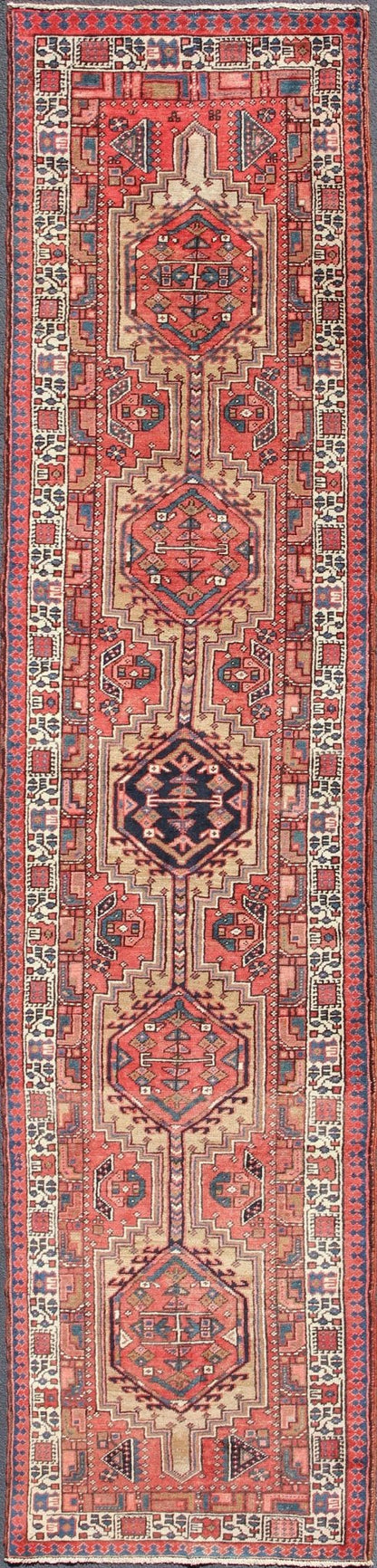 Geometric Medallion design multicolored vintage Persian Karadjeh runner, rug h - 407 - 1, country of origin / type: Iran / Karadjeh, circa 1950. This, handwoven vintage Persian Karadjeh runner features a light camel and soft red - colored field imbued... - Keivan Woven ArtsH - 407 - 1 - 1318Rug