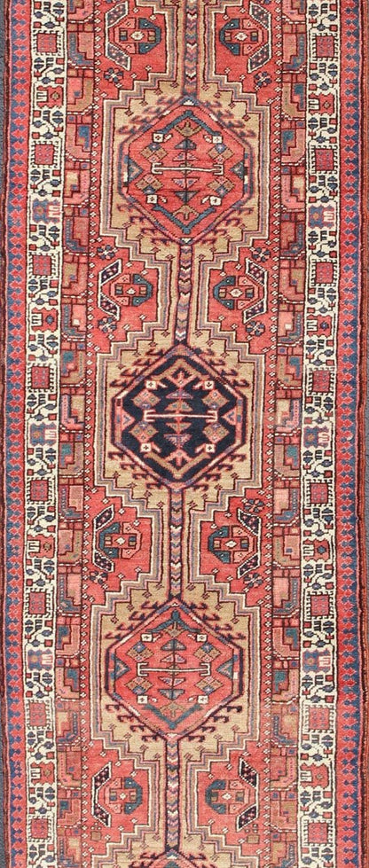 Geometric Medallion design multicolored vintage Persian Karadjeh runner, rug h - 407 - 1, country of origin / type: Iran / Karadjeh, circa 1950. This, handwoven vintage Persian Karadjeh runner features a light camel and soft red - colored field imbued... - Keivan Woven ArtsH - 407 - 1 - 1318Rug