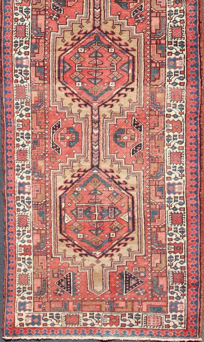 Geometric Medallion design multicolored vintage Persian Karadjeh runner, rug h - 407 - 1, country of origin / type: Iran / Karadjeh, circa 1950. This, handwoven vintage Persian Karadjeh runner features a light camel and soft red - colored field imbued... - Keivan Woven ArtsH - 407 - 1 - 1318Rug