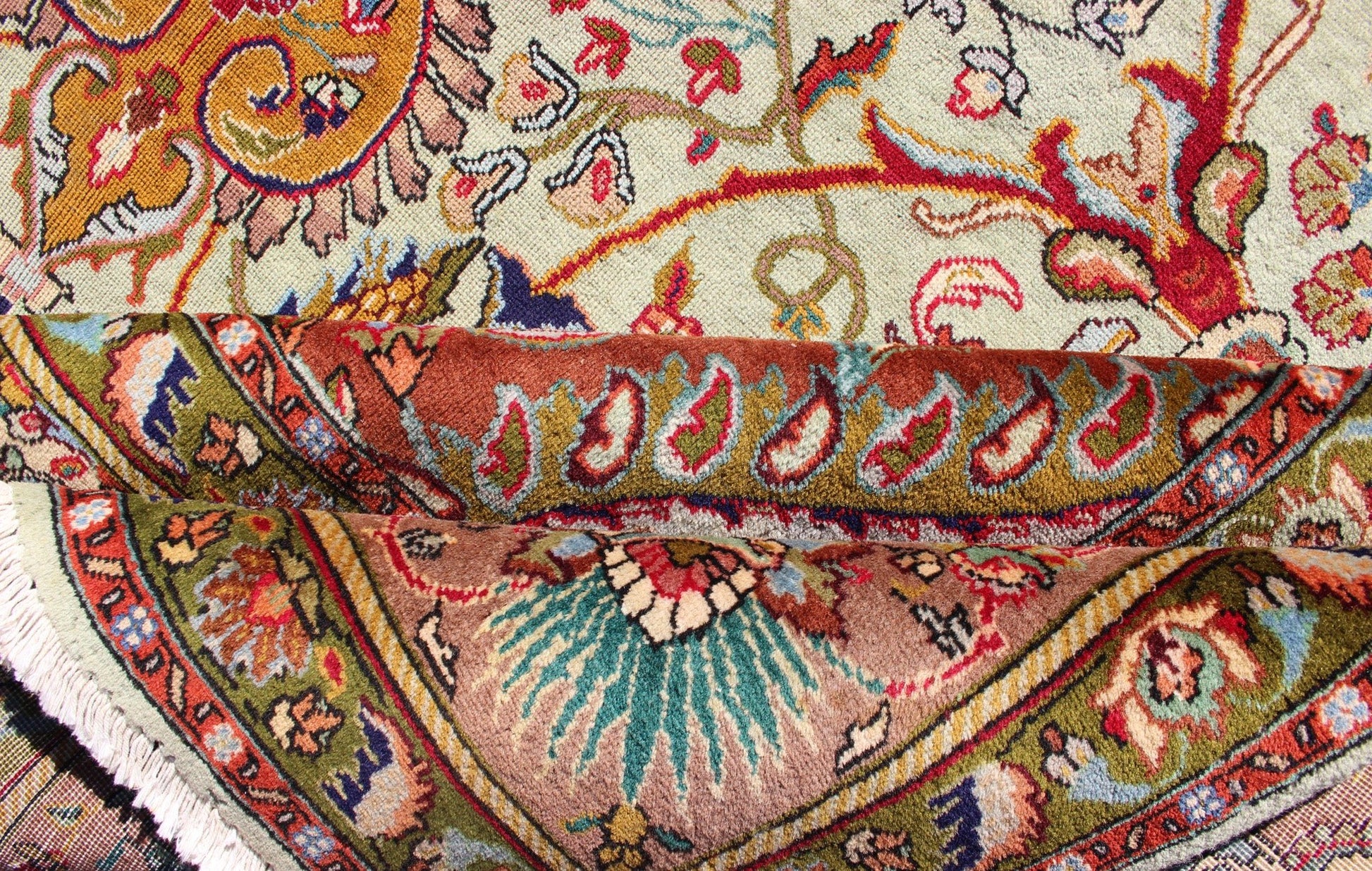 Classic Persian Tabriz Vintage Rug in Celadon Green, Salmon & Multi Colors. Tabriz vintage rug from Persia with a classic medallion Floral design in beautiful celadon green background, salmon border with accent colors of red, yellow or orange and i... - Keivan Woven ArtsH - 609 - 26 - 1213Rug