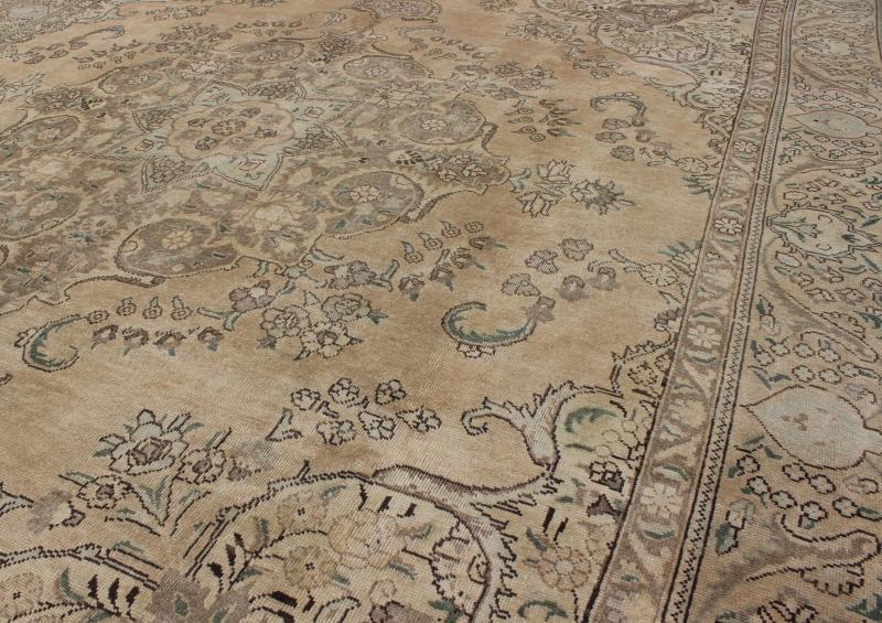 Vintage Muted Persian Tabriz Rug With Large Floral Medallion in Earthy Tones This mid - 20th century, handwoven vintage Persian Tabriz rug features an expansive all - over floral design. A beautifully drawn multi - tiered border surrounds the entirety... - Keivan Woven ArtsH - 702 - 11 - 3732Rug