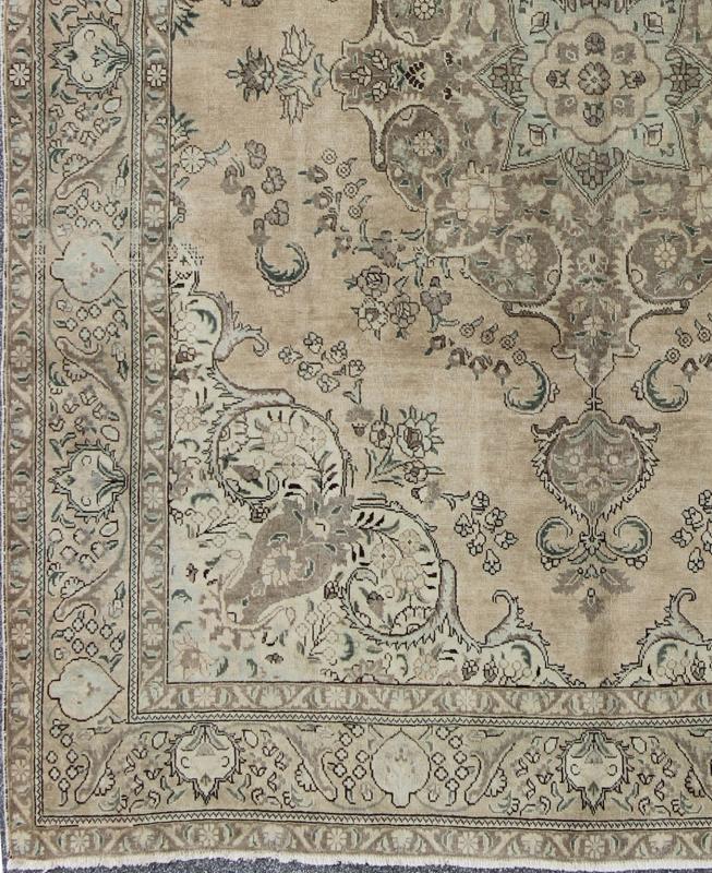 Vintage Muted Persian Tabriz Rug With Large Floral Medallion in Earthy Tones This mid - 20th century, handwoven vintage Persian Tabriz rug features an expansive all - over floral design. A beautifully drawn multi - tiered border surrounds the entirety... - Keivan Woven ArtsH - 702 - 11 - 3732Rug