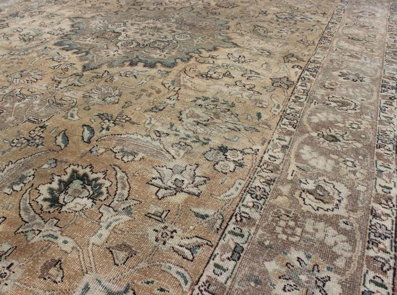 Persian rug Tabriz style with floral design tan medallion, rug H - 703 - 02, country of origin / type: Iran / Tabriz, circa 1950. This Persian Tabriz carpet (circa 1950) features a refined palate of various shades of tans, taupe, and touches of gree... - Keivan Woven ArtsH - 703 - 02 - 1275Rug