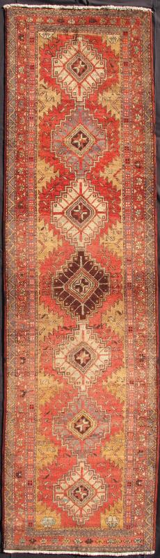 Keivan Woven Arts, H - 711 - 15, 1950's Semi Antique Heriz Runner Rug. This mid - 20th century, handwoven Semi Antique Heriz runner features a red - colored field imbued with a ornate medallions. A beautifully drawn multi - tiered border surrounds the entirety o... - Keivan Woven ArtsH - 711 - 15 - 1374Rug