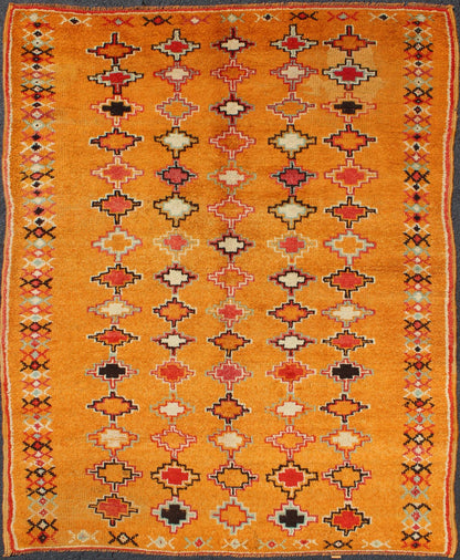 Saffron color antique Moroccan carpet with geometric patterns with orange, red, black, charcoal, white, light blue and ivory, rug H8 - 0802, country of origin / type: Morocco / Tribal, circa 1920. Crafted in the early 20th century, this gorgeous A... - Keivan Woven ArtsH8 - 0802 - 2121Rug