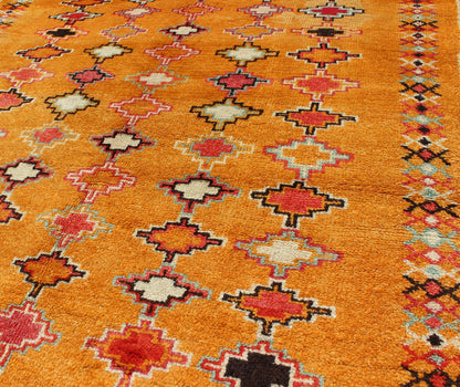 Saffron color antique Moroccan carpet with geometric patterns with orange, red, black, charcoal, white, light blue and ivory, rug H8 - 0802, country of origin / type: Morocco / Tribal, circa 1920. Crafted in the early 20th century, this gorgeous A... - Keivan Woven ArtsH8 - 0802 - 2121Rug