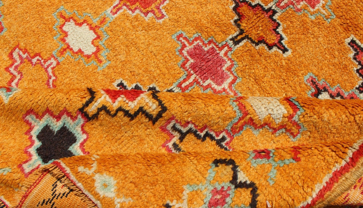 Saffron color antique Moroccan carpet with geometric patterns with orange, red, black, charcoal, white, light blue and ivory, rug H8 - 0802, country of origin / type: Morocco / Tribal, circa 1920. Crafted in the early 20th century, this gorgeous A... - Keivan Woven ArtsH8 - 0802 - 2121Rug