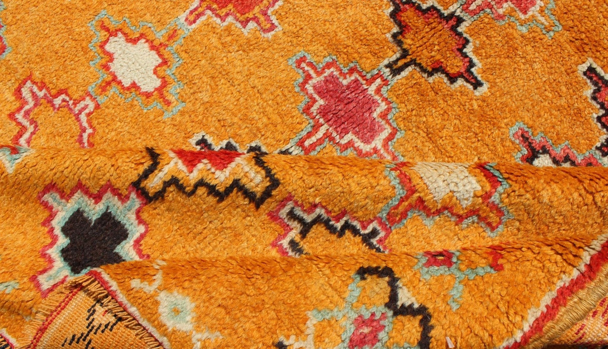 Saffron color antique Moroccan carpet with geometric patterns with orange, red, black, charcoal, white, light blue and ivory, rug H8 - 0802, country of origin / type: Morocco / Tribal, circa 1920. Crafted in the early 20th century, this gorgeous A... - Keivan Woven ArtsH8 - 0802 - 2121Rug