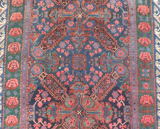 Antique Caucasian 19th Century Seychour Rug in Blue, Green, Brown & Multi Colors. Set on an indigo background this antique 19th Century Seychour Caucasian rug features four intricate medallions composed of delightful rich colors. The entire piece i... - Keivan Woven ArtsH8 - 1105 - 2633Rug