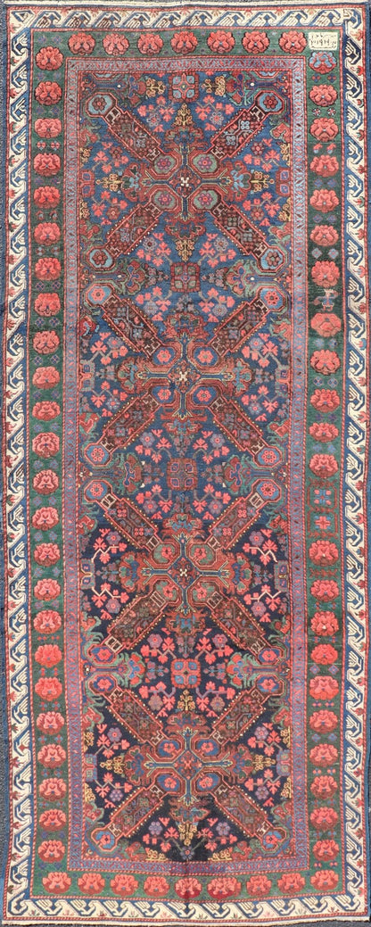 Antique Caucasian 19th Century Seychour Rug in Blue, Green, Brown & Multi Colors. Set on an indigo background this antique 19th Century Seychour Caucasian rug features four intricate medallions composed of delightful rich colors. The entire piece i... - Keivan Woven ArtsH8 - 1105 - 2633Rug
