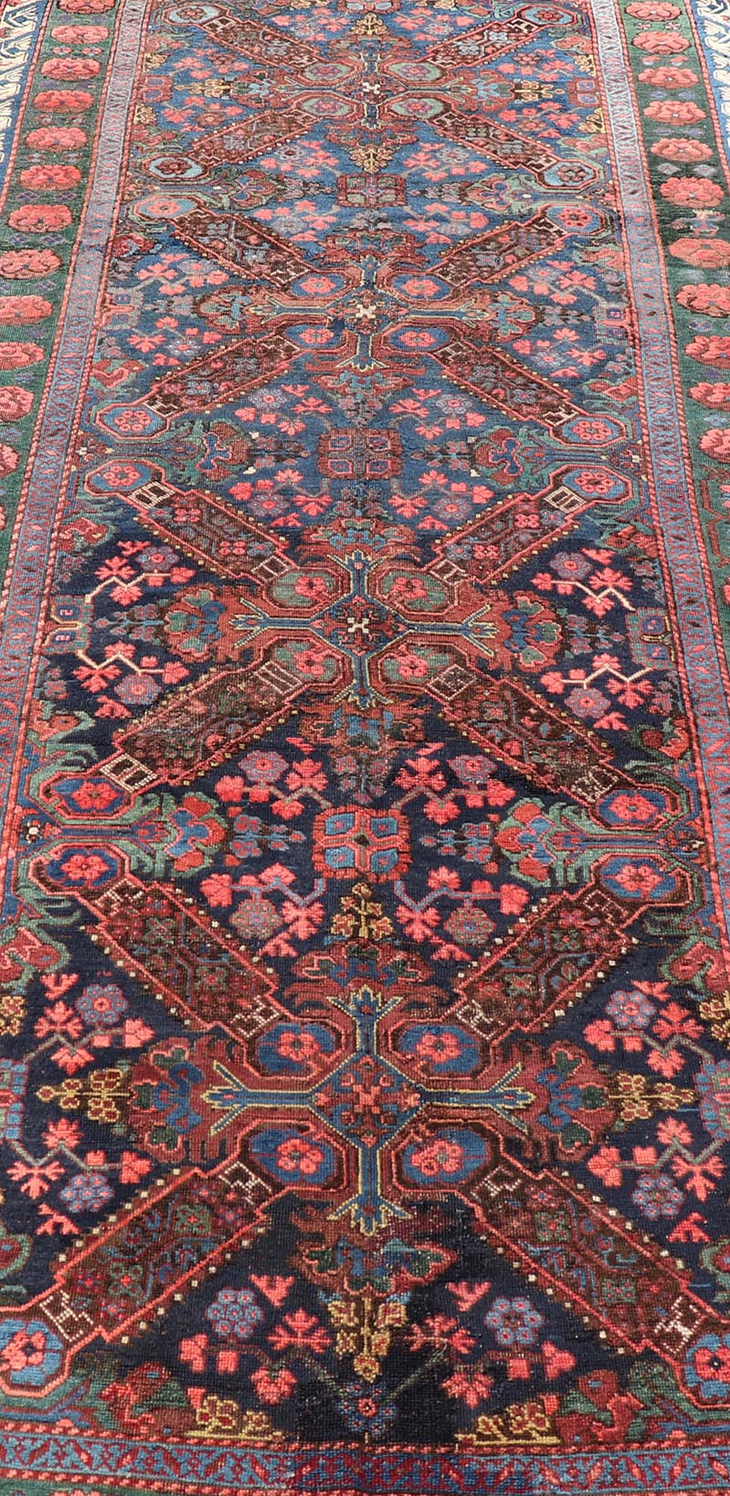 Antique Caucasian 19th Century Seychour Rug in Blue, Green, Brown & Multi Colors. Set on an indigo background this antique 19th Century Seychour Caucasian rug features four intricate medallions composed of delightful rich colors. The entire piece i... - Keivan Woven ArtsH8 - 1105 - 2633Rug