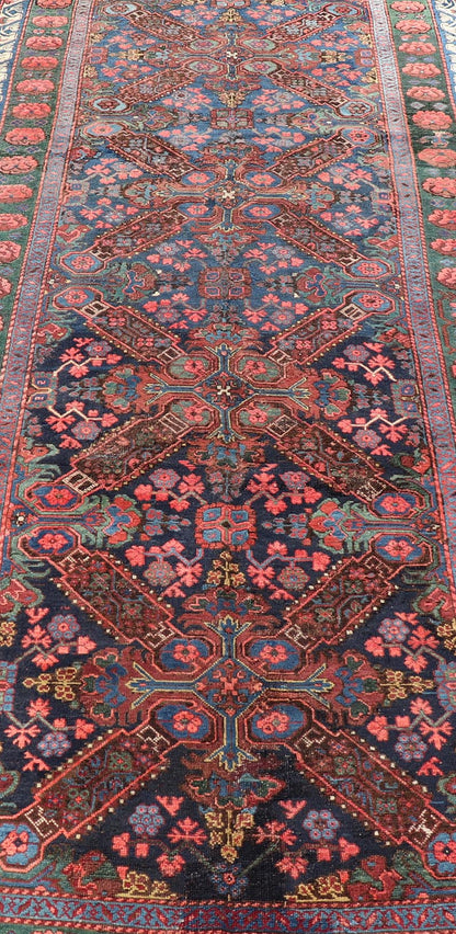 Antique Caucasian 19th Century Seychour Rug in Blue, Green, Brown & Multi Colors. Set on an indigo background this antique 19th Century Seychour Caucasian rug features four intricate medallions composed of delightful rich colors. The entire piece i... - Keivan Woven ArtsH8 - 1105 - 2633Rug