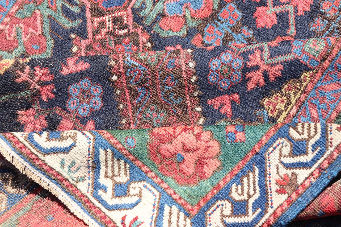 Antique Caucasian 19th Century Seychour Rug in Blue, Green, Brown & Multi Colors. Set on an indigo background this antique 19th Century Seychour Caucasian rug features four intricate medallions composed of delightful rich colors. The entire piece i... - Keivan Woven ArtsH8 - 1105 - 2633Rug