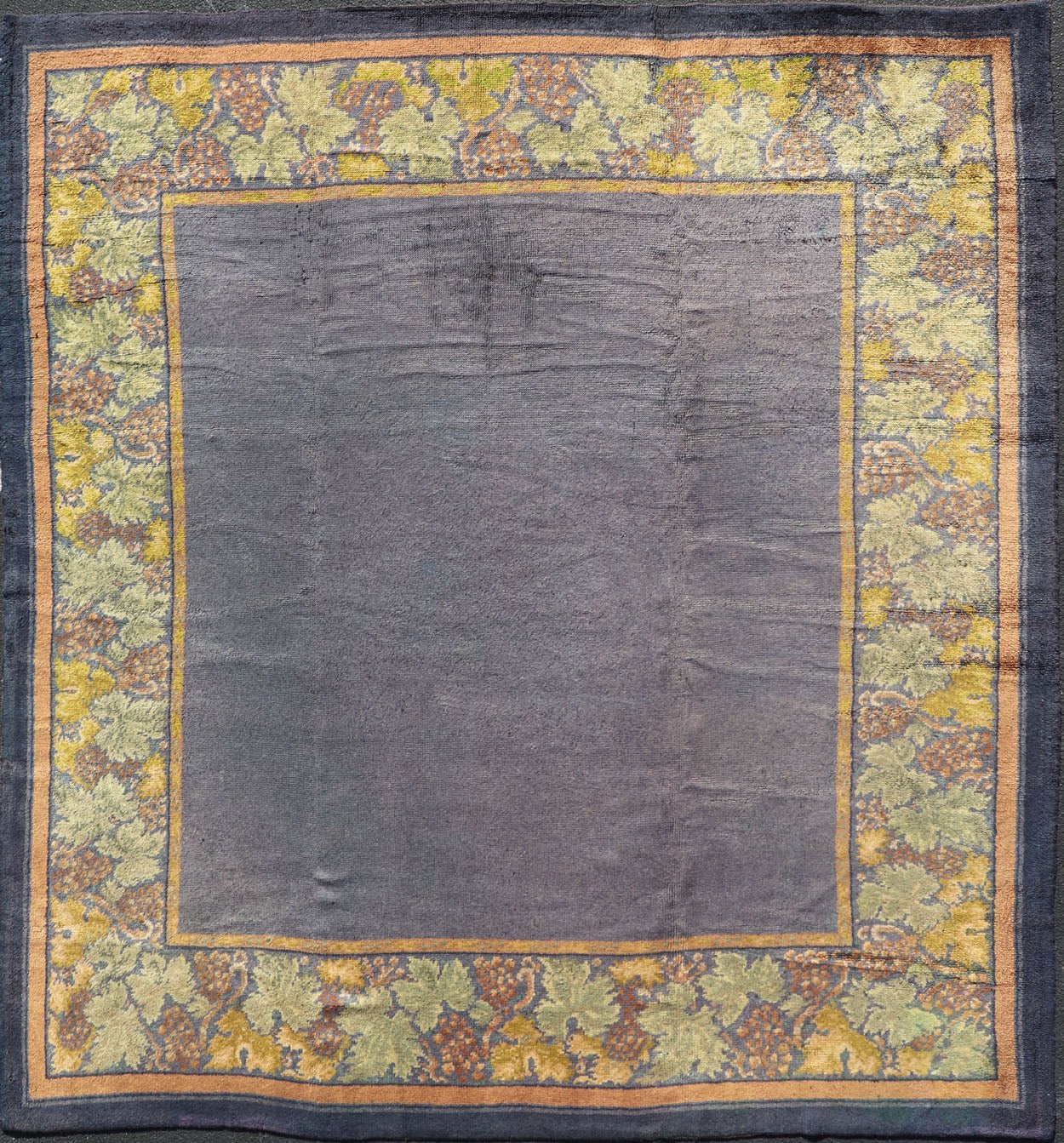 Antique Donegal carpet from Ireland in solid Purple Background and Floral Border in a near square size. Keivan Woven Arts / Rug/ HAS - 3327. Donegal rug, Antique Donegal. Measures: 10'6 x 10'10. Made in Ireland, this beautifully crafted Donegal ca... - Keivan Woven ArtsHAS - 3327 - 4176Rug