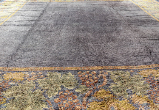 Antique Donegal carpet from Ireland in solid Purple Background and Floral Border in a near square size. Keivan Woven Arts / Rug/ HAS - 3327. Donegal rug, Antique Donegal. Measures: 10'6 x 10'10. Made in Ireland, this beautifully crafted Donegal ca... - Keivan Woven ArtsHAS - 3327 - 4176Rug