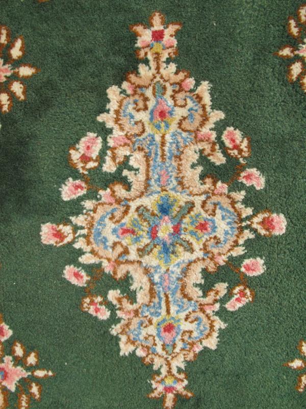 Small Green Kerman Rug with Central Medallion and Matching Floral Border This mid - 20th century Kerman carpet from Iran features a center medallion and matching floral border set atop a green background. Measures: 2'0 x 3'0. - Keivan Woven ArtsHG - 78001 - 1265Rug