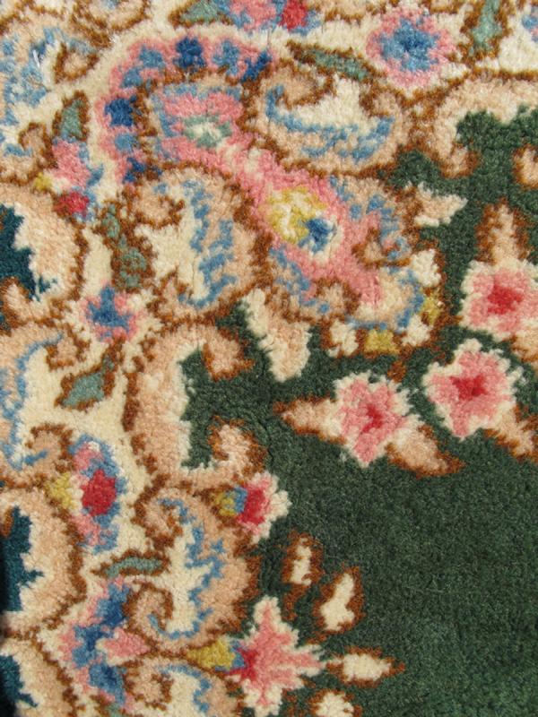 Small Green Kerman Rug with Central Medallion and Matching Floral Border This mid - 20th century Kerman carpet from Iran features a center medallion and matching floral border set atop a green background. Measures: 2'0 x 3'0. - Keivan Woven ArtsHG - 78001 - 1265Rug