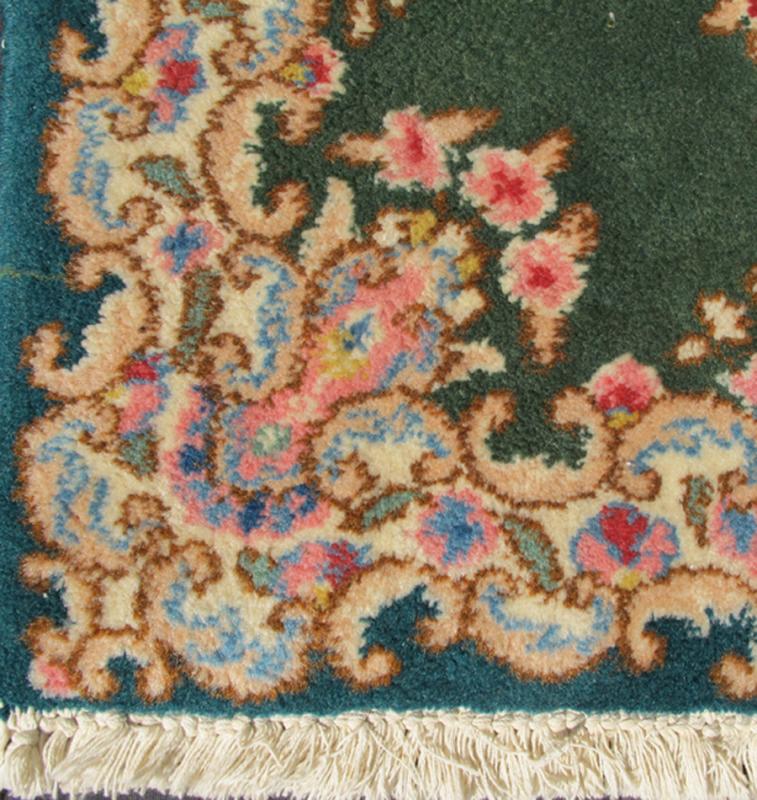 Small Green Kerman Rug with Central Medallion and Matching Floral Border This mid - 20th century Kerman carpet from Iran features a center medallion and matching floral border set atop a green background. Measures: 2'0 x 3'0. - Keivan Woven ArtsHG - 78001 - 1265Rug