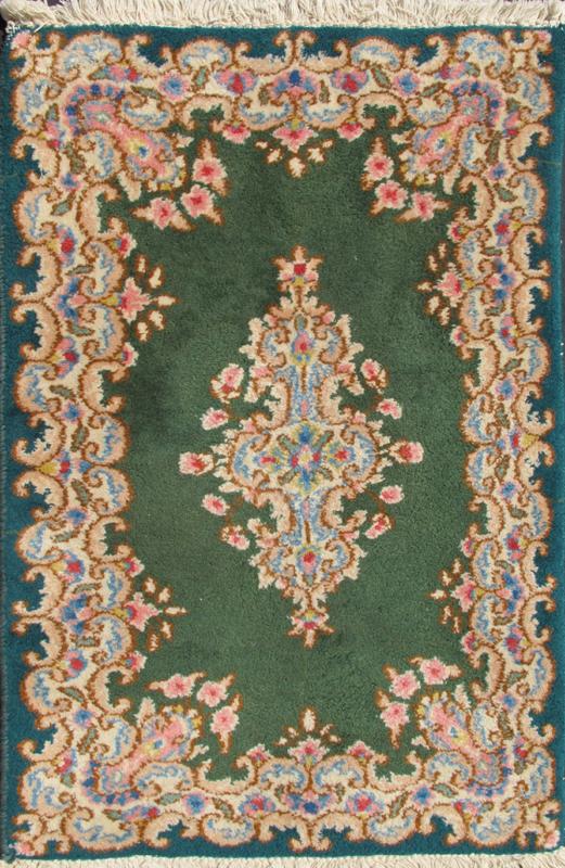 Small Green Kerman Rug with Central Medallion and Matching Floral Border This mid - 20th century Kerman carpet from Iran features a center medallion and matching floral border set atop a green background. Measures: 2'0 x 3'0. - Keivan Woven ArtsHG - 78001 - 1265Rug