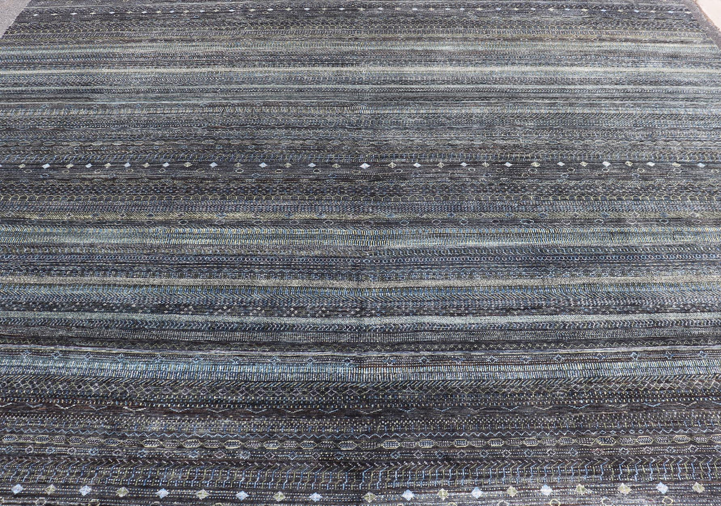 Large Modern Rug with Transitional Design in Shades of Black, Greens and Blue's. Keivan Woven Arts /origin/ India Circa / 2020 - Rug/ HUY - 99SK601 / 21st Century. Measures: 12'1 x 16'0 This fine hand - woven Modern Transitional rug features a beauti... - Keivan Woven ArtsHUY - 99SK601 - 25200Rug