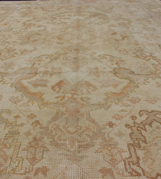 Antique Turkish Hand Knotted Oushak Rug in Taupe, Beige, Green and Copper Antique Oushak rug in taupe, beige, green copper, peach, muted brown, Keivan Woven Arts / rug / I - 1003. Antique Oushak rug Measures: 8'3 x 12'10. This antiqu... - Keivan Woven ArtsI - 1003 - 1857Rug