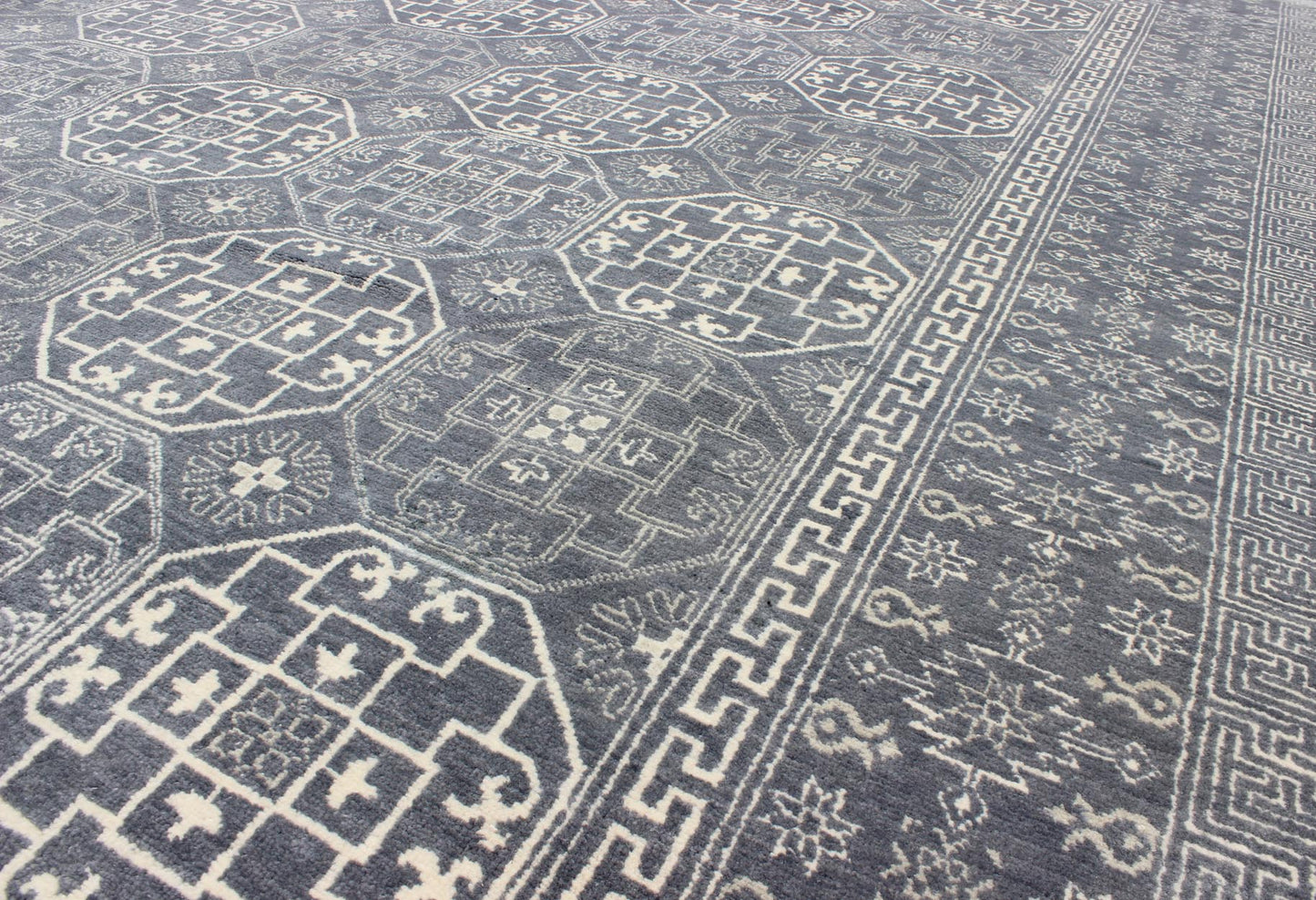 Antique Reproduction Indian Khotan Rug. Measures: 7'11 x 9'10. This attractive reproduction Khotan rug is a spectacular testament to the complexity of Turkestan design. The dark blue central field plays host to a stunning all - over display of inte... - Keivan Woven ArtsIN - BAM - 59077 - 8283Rug