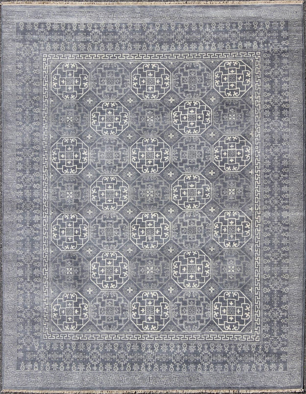 Antique Reproduction Indian Khotan Rug. Measures: 7'11 x 9'10. This attractive reproduction Khotan rug is a spectacular testament to the complexity of Turkestan design. The dark blue central field plays host to a stunning all - over display of inte... - Keivan Woven ArtsIN - BAM - 59077 - 8283Rug