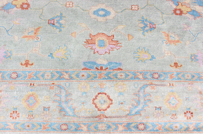 Hand - Knotted Floral Oushak Designed Rug in Light Blue, Orange, and Blue Measures 9'1 x 11'8 This wool Oushak was hand - knotted in the 2020's. The field and border both have a cool blue gray. The field and border also share floral and leaf... - Keivan Woven ArtsIN - CLR - 1002 - 13444