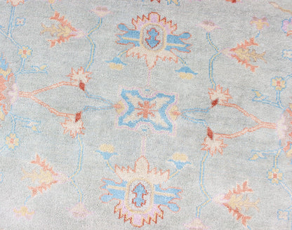 Hand - Knotted Floral Oushak Designed Rug in Light Blue, Orange, and Blue Measures 9'1 x 11'8 This wool Oushak was hand - knotted in the 2020's. The field and border both have a cool blue gray. The field and border also share floral and leaf... - Keivan Woven ArtsIN - CLR - 1002 - 13444