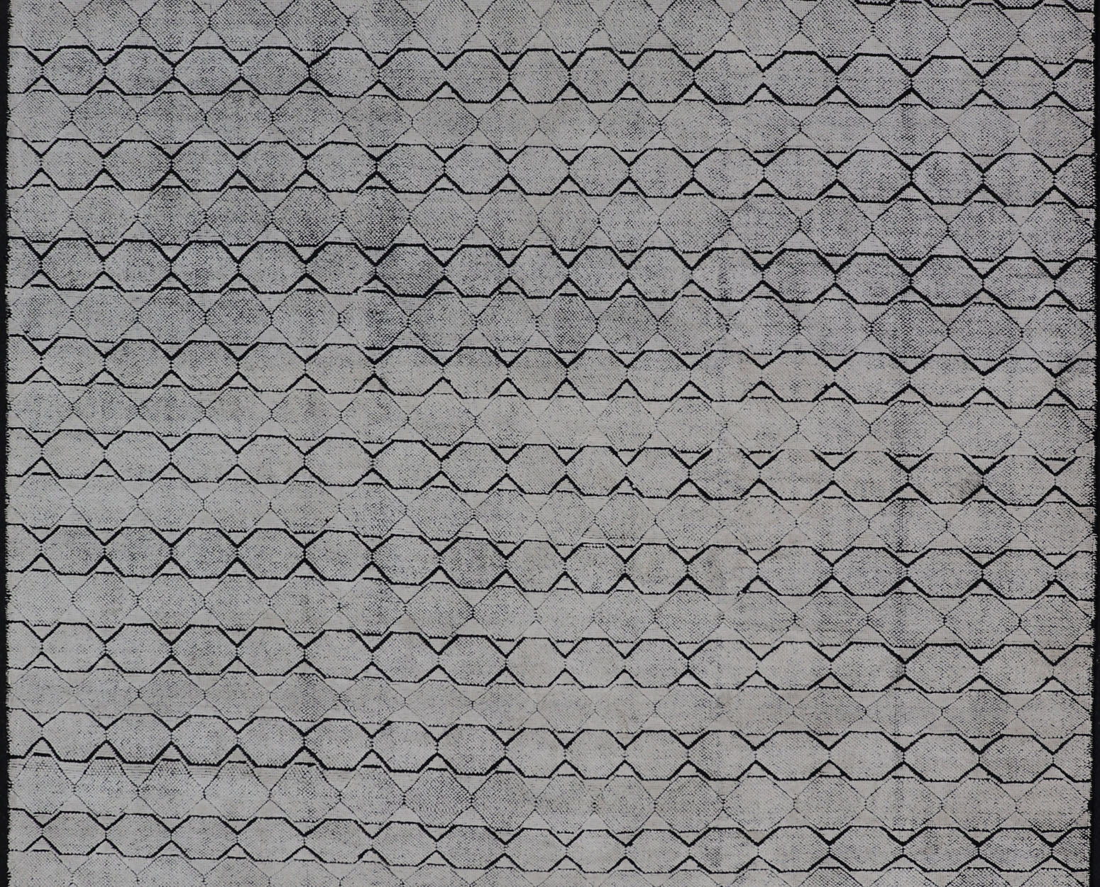 All - Over Geometric Modern Large Rug in Ivory and Black Measures 9'0 x 12'0 This modern rug features a field of a ivory with a simple geometric design lined by black. The design is a minimalistic, repeating pattern of octagons panelin... - Keivan Woven ArtsIN - ILM - 161 - MK - 6335 - 20982Rug