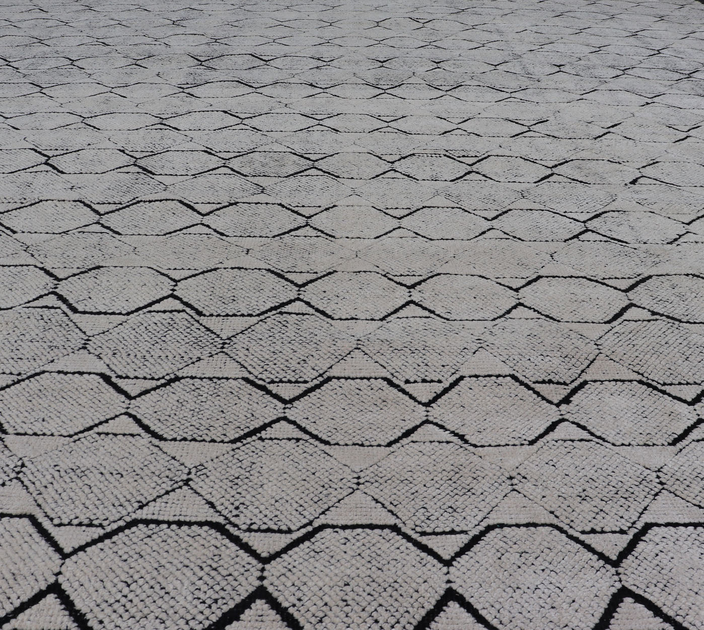 All - Over Geometric Modern Large Rug in Ivory and Black Measures 9'0 x 12'0 This modern rug features a field of a ivory with a simple geometric design lined by black. The design is a minimalistic, repeating pattern of octagons panelin... - Keivan Woven ArtsIN - ILM - 161 - MK - 6335 - 20982Rug