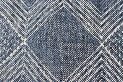 Modern Indian Area Rug with Tribal Design in Denim Blue and Ivory Measures 6'0 x 8'11 This elegant piece features a classic tribal stylization of vertical diamond medallions with a minimal twist. The medallions have a more modern de... - Keivan Woven ArtsIN - ILM - 165 - CB - 4018 - 20922