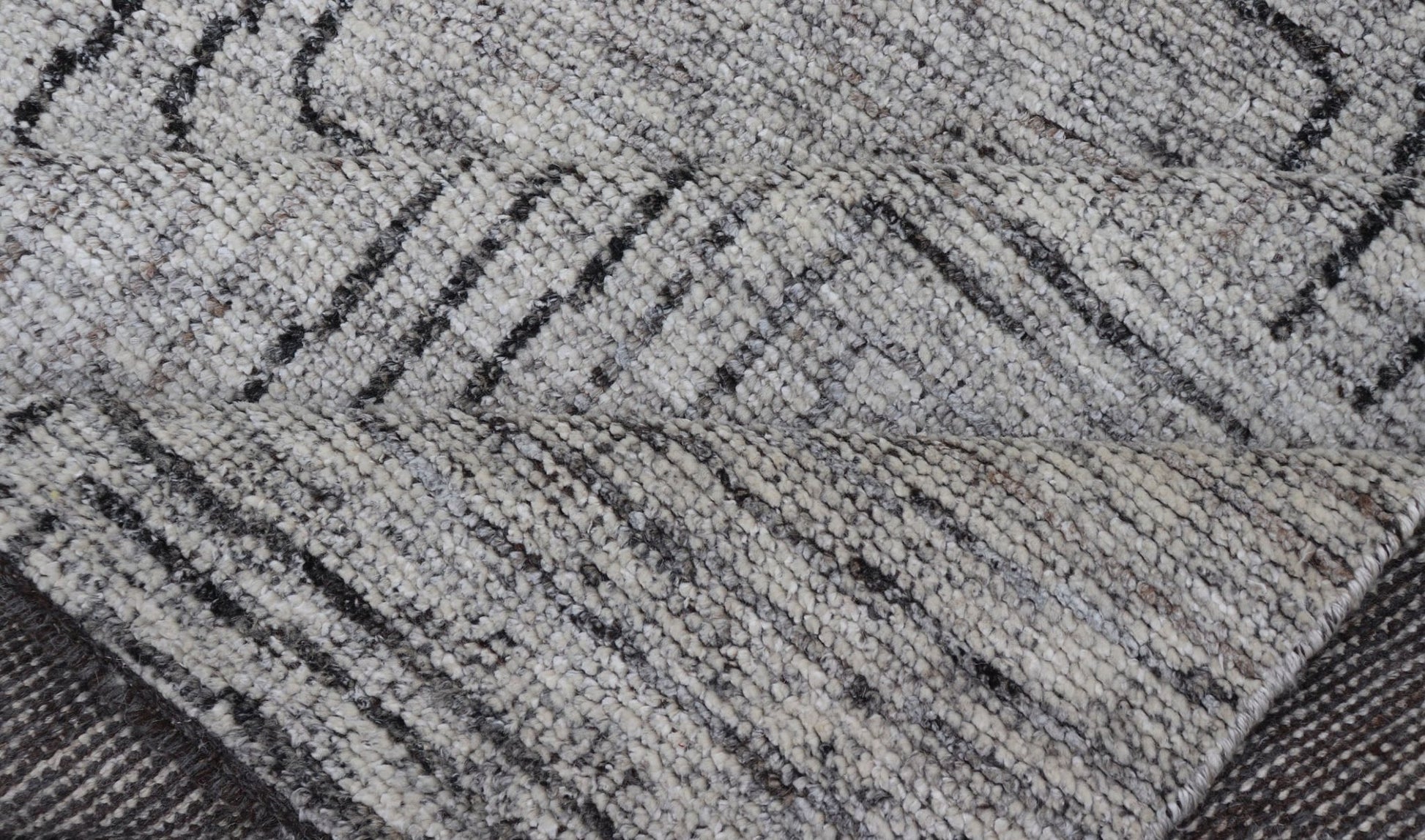 Indian Modern Hand Knotted Design With All Neutral Colored Wool Area Rug Measures 6 x 8'8 This modern area rug features varying shades of gray in the field, blending neutrals into a near - homogenous color. The simple design vines all - ove... - Keivan Woven ArtsIN - ILM - 167 - VT - 516 - 21096