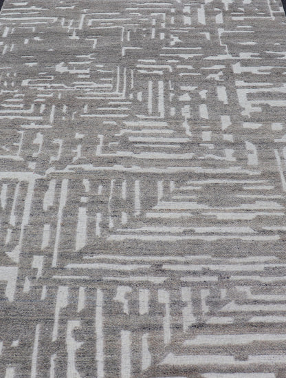Modern Hand Knotted Wool Area Rug in Cream and Light Gray With Abstract Design Measures 5'8 x 8'5 This modern area rug was hand - knotted in during the 2020's. The field features a sub - geometric abstract design cover the entirety of the fa... - Keivan Woven ArtsIN - ILM - 172 - HW - 2330 - 21006Rug
