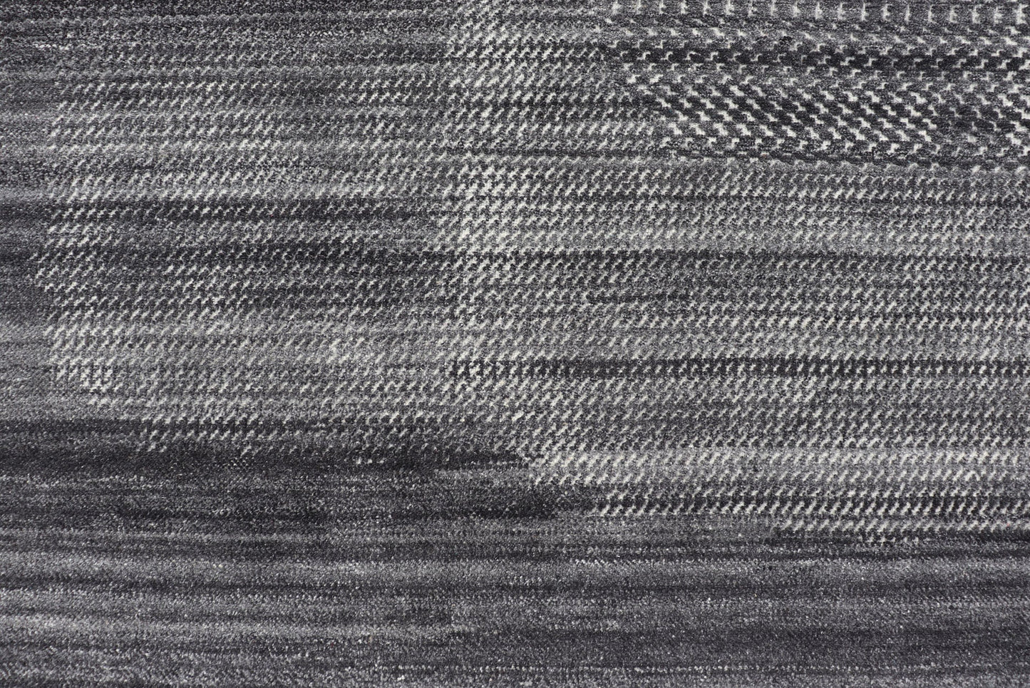 This modern abstract rug was hand - knotted with wool in India. The design features no definite pattern, but "scrapes" of ivory on a smoky charcoal background, loosely giving a tire track likeness. This piece is contemporary and neutral, yet masculine an... - Keivan Woven ArtsIN - ILM - 3391 - MN - 0043 - 18156