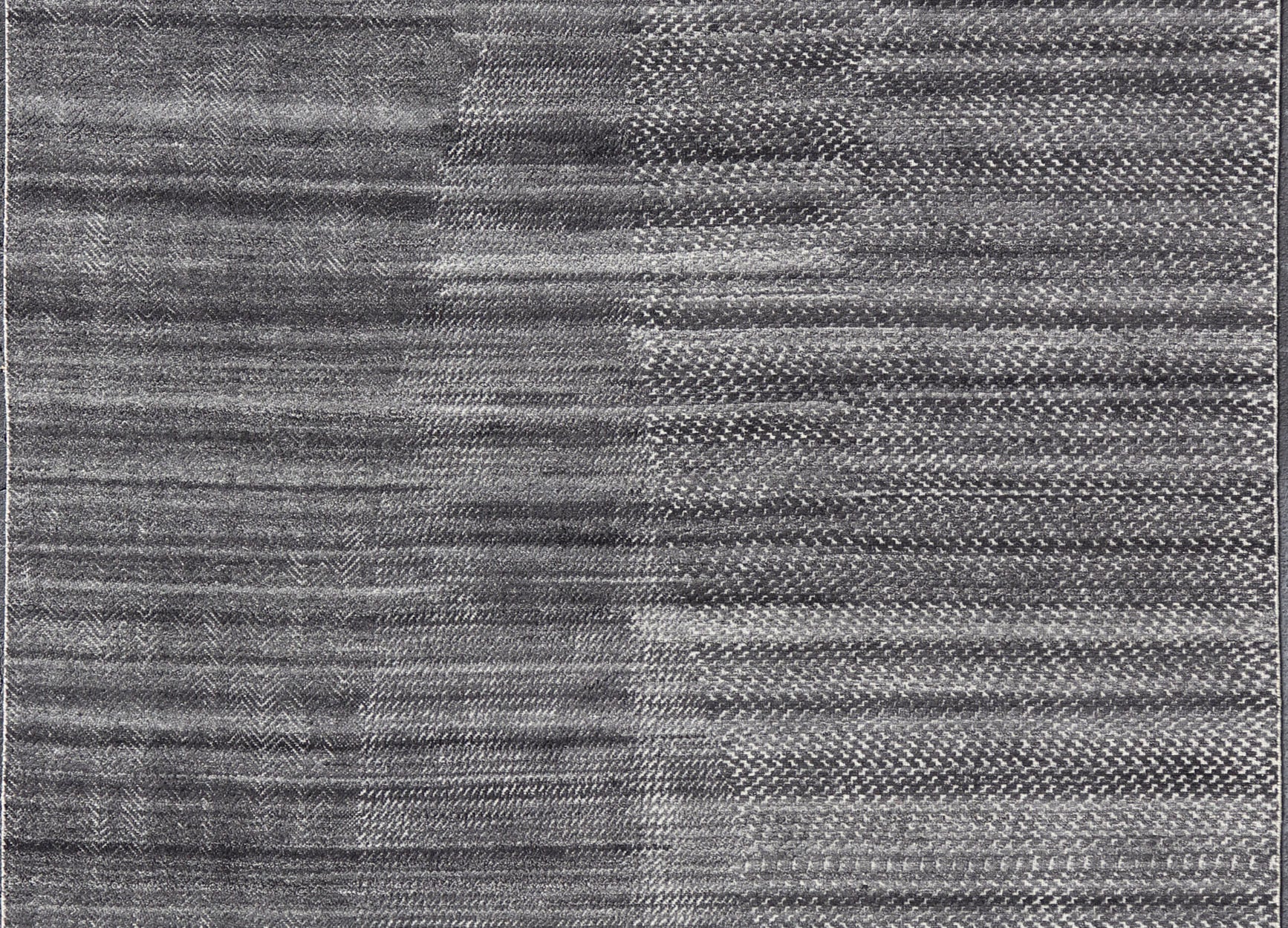 This modern abstract rug was hand - knotted with wool in India. The design features no definite pattern, but "scrapes" of ivory on a smoky charcoal background, loosely giving a tire track likeness. This piece is contemporary and neutral, yet masculine an... - Keivan Woven ArtsIN - ILM - 3391 - MN - 0043 - 18156Rug