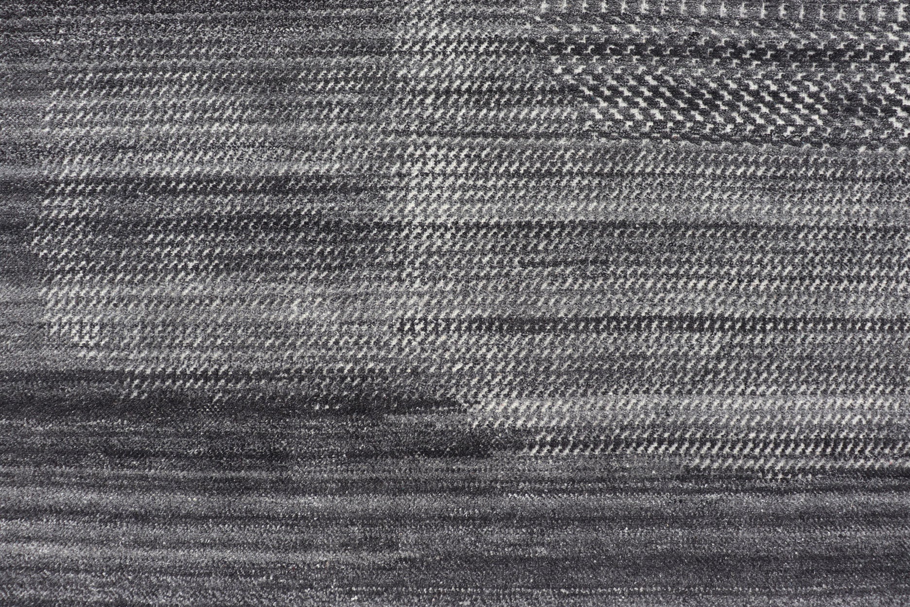 This modern abstract rug was hand - knotted with wool in India. The design features no definite pattern, but "scrapes" of ivory on a smoky charcoal background, loosely giving a tire track likeness. This piece is contemporary and neutral, yet masculine an... - Keivan Woven ArtsIN - ILM - 3391 - MN - 0043 - 18156Rug