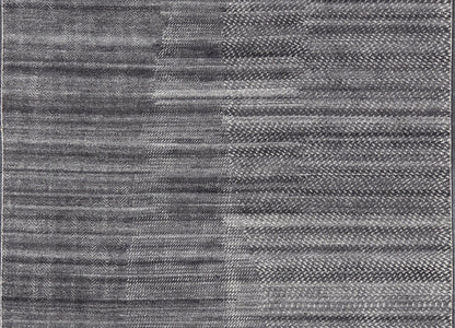 This modern abstract rug was hand - knotted with wool in India. The design features no definite pattern, but "scrapes" of ivory on a smoky charcoal background, loosely giving a tire track likeness. This piece is contemporary and neutral, yet masculine an... - Keivan Woven ArtsIN - ILM - 3391 - MN - 0043 - 18156