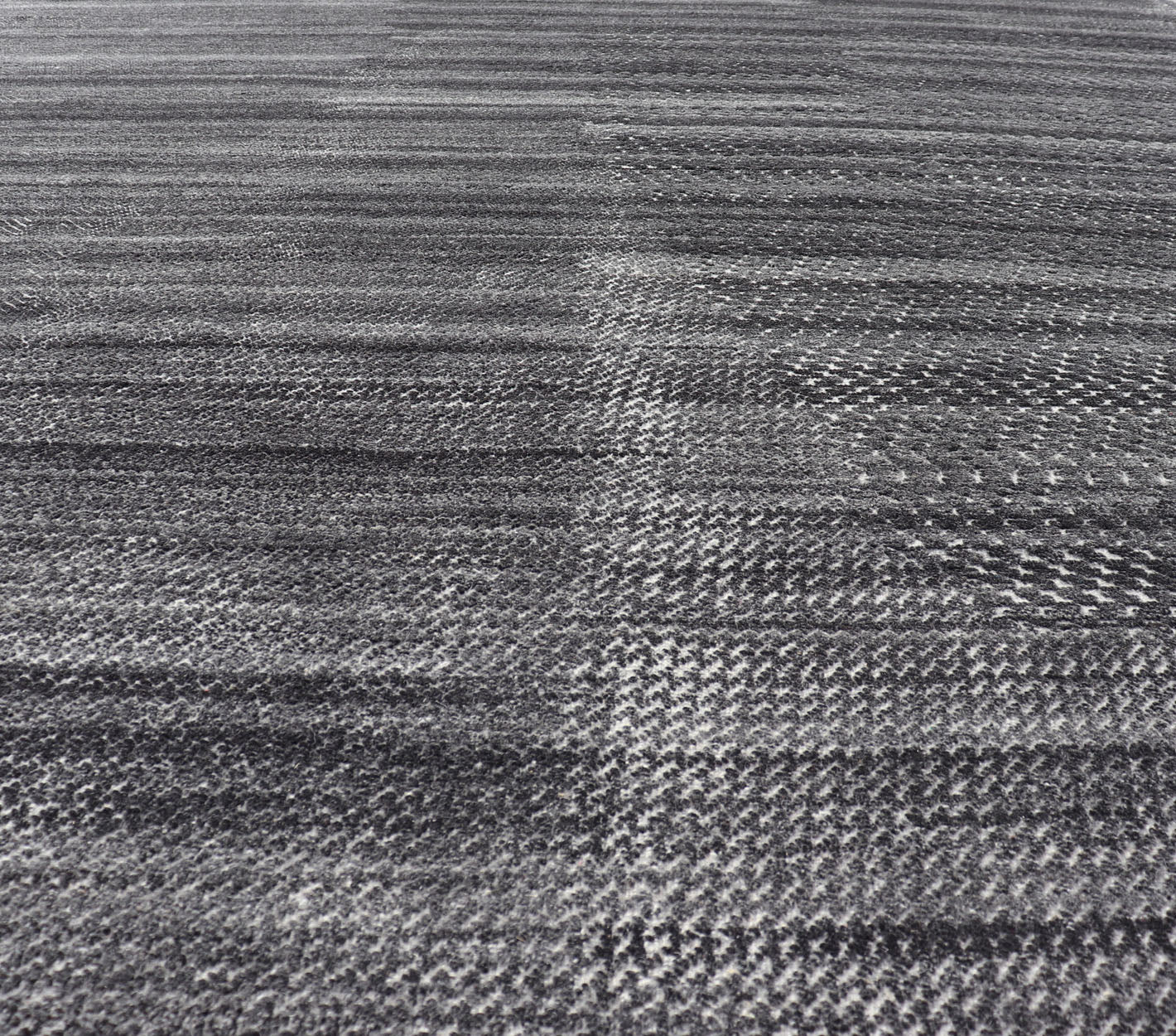 This modern abstract rug was hand - knotted with wool in India. The design features no definite pattern, but "scrapes" of ivory on a smoky charcoal background, loosely giving a tire track likeness. This piece is contemporary and neutral, yet masculine an... - Keivan Woven ArtsIN - ILM - 3391 - MN - 0043 - 18156