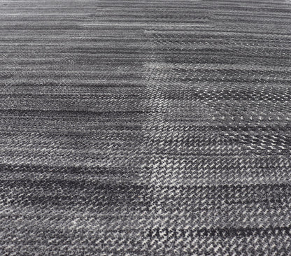This modern abstract rug was hand - knotted with wool in India. The design features no definite pattern, but "scrapes" of ivory on a smoky charcoal background, loosely giving a tire track likeness. This piece is contemporary and neutral, yet masculine an... - Keivan Woven ArtsIN - ILM - 3391 - MN - 0043 - 18156